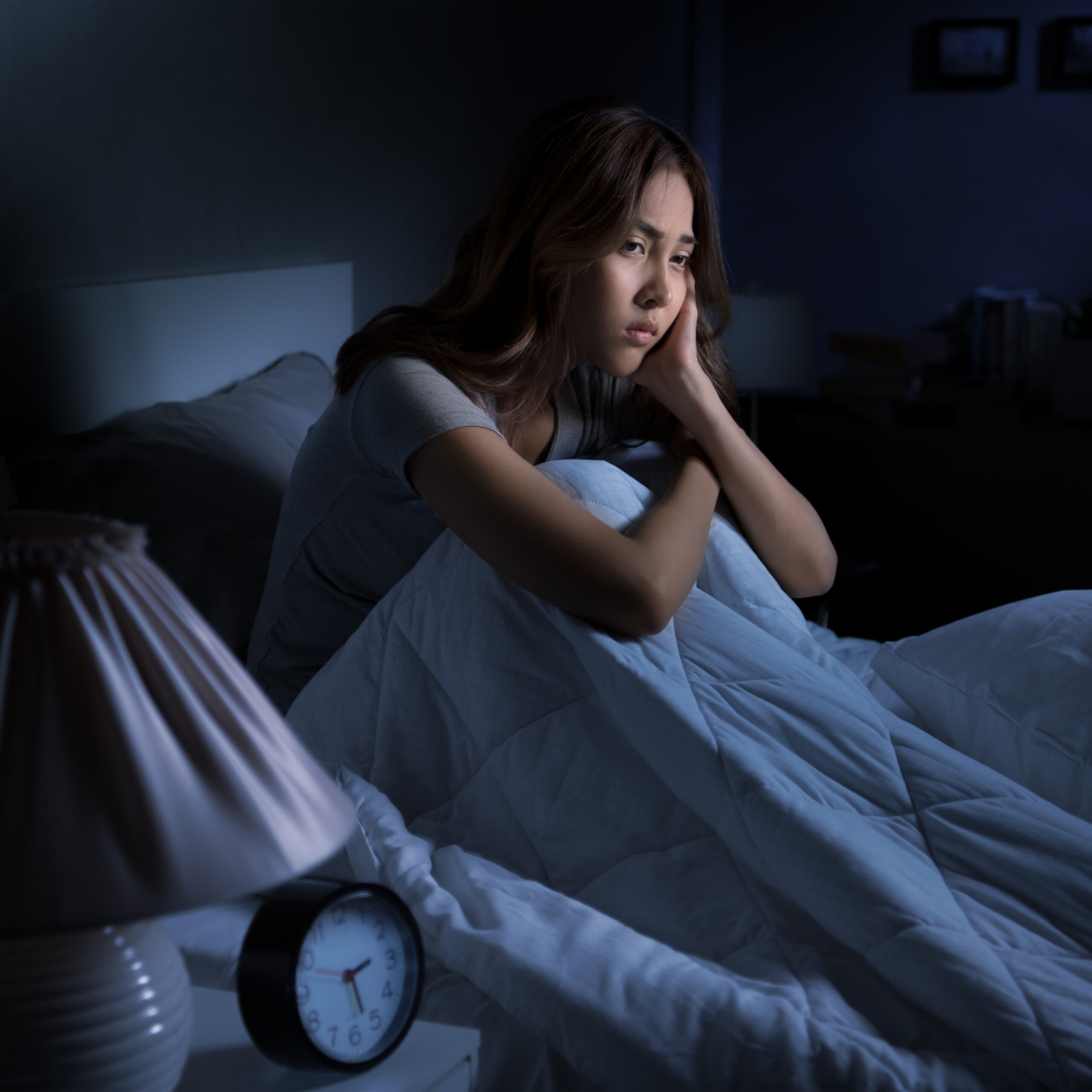 Woman Awake in Bed